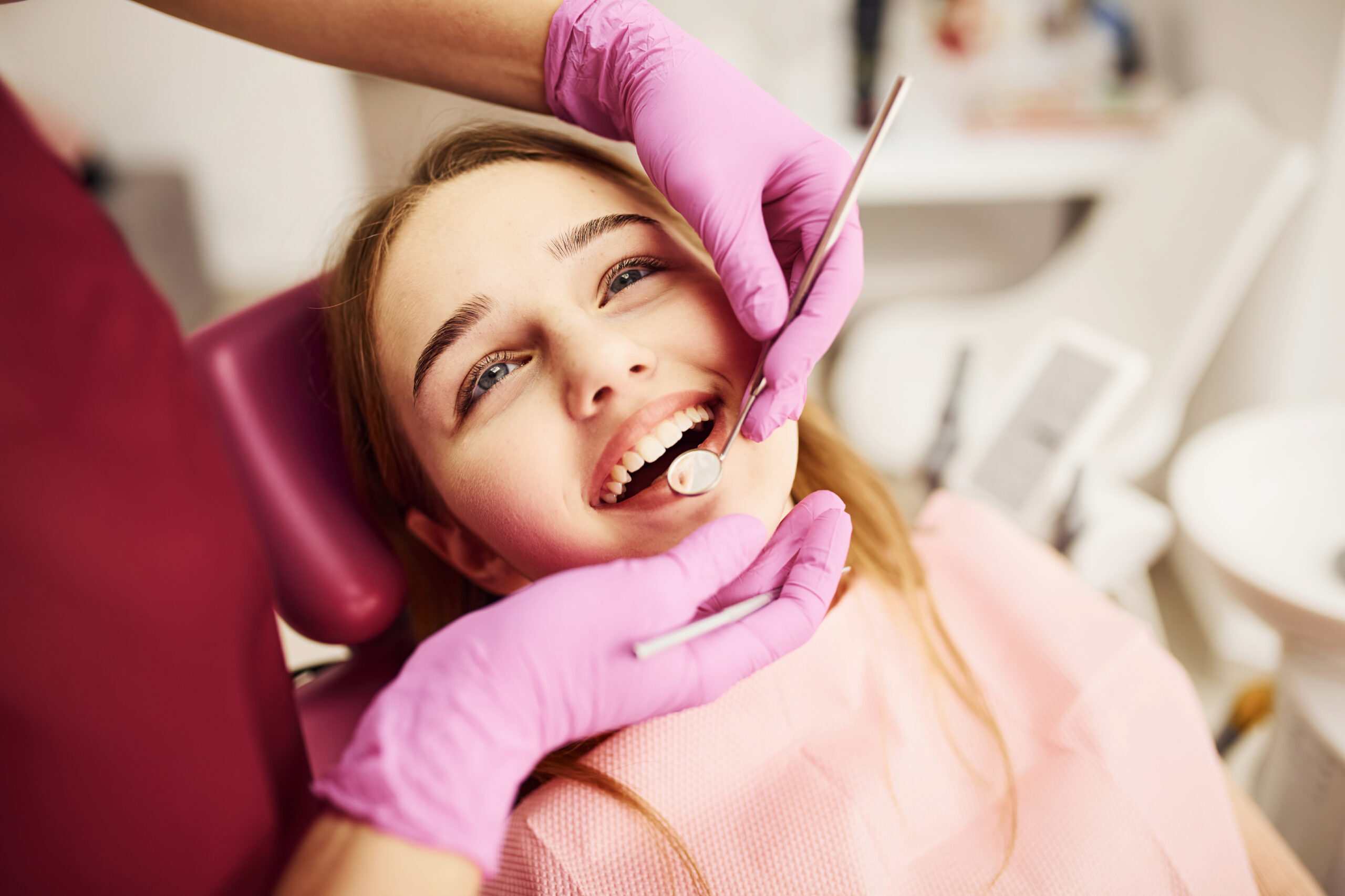 Little girl visiting dentist in clinic. Conception of stomatology.